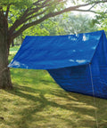 Blue tarp tent set up among trees using Cam Jam Rope Tightener Set For Tents, Easy Rope Length Adjustment And Tension.
