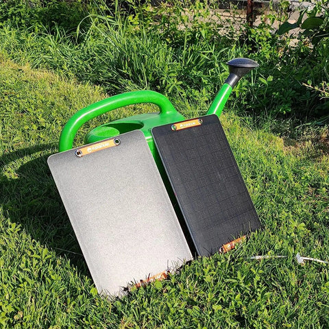 2 Pack USB Solar Panel Kit 6W 5V Monocrystalline Mini Panels With USB 2.0 Port Waterproof IP67 in outdoor grass setting.