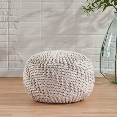 Indoor Outdoor Fabric Weave Pouf In Ivory Cozy Round Handmade Accent Stool For Living Room Or Patio Modern Design Soft Texture Durable Craft Perfect For Extra Seating Footrest And Chill Vibes. 20 inch round ivory pouf on wooden floor with textured pattern.