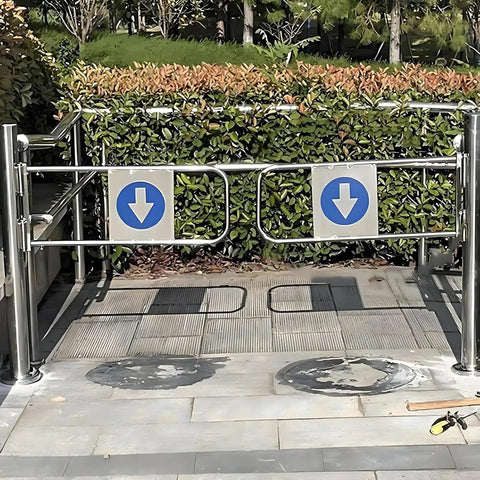 Premium Heavy Duty Self Closing Security Gate Featuring Slick One Way Swing Action For Bustling Warehouses And Supermarket Aisles With Zero Hassle Pedestrian Flow Control, stainless steel frame with directional signage.