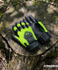 Hi-Vis Chainsaw Gloves With Anti-Vibration Padding And Cut-Resistant Kevlar Leather For Tree Cutting on a tree stump