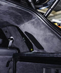 Installed view of black suede auto headliner fabric with foam backing on car roof.