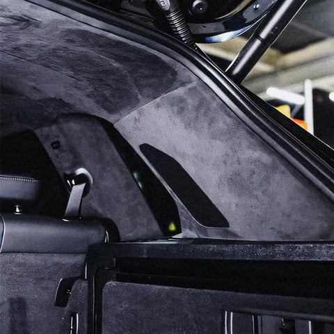 Installed view of black suede auto headliner fabric with foam backing on car roof.