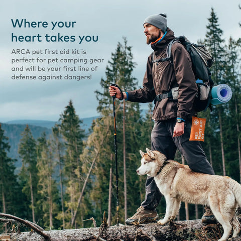 Man hiking with dog carrying Waterproof High Visibility Dog First Aid Kit For Hiking Camping Backpacking Sports And Hunting.