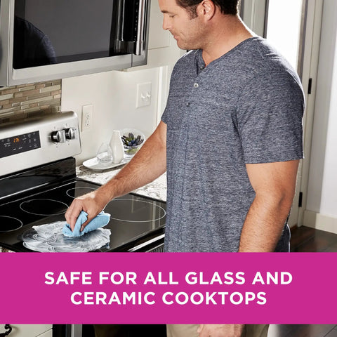 Person using Glass And Ceramic Cooktop Cleaner 10 Oz For Stubborn Baked On Gunk Safe On Glass And Ceramic Surfaces Includes Two Handy Cleaning Pads