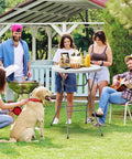 Group enjoying outdoor party with 32 Inch Plastic Folding Round Bar Height Table With Gray Metal Finish and drinks