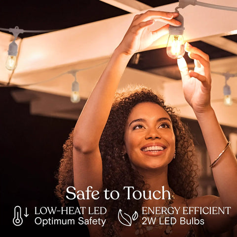 Person installing Waterproof Outdoor String Lights 48 Ft With 15 Dimmable Vintage Edison LED Bulbs 2W Each Hanging Patio Decor