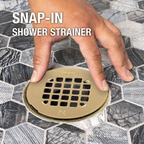 Universal 4 Inch Round Shower Strainer Snap In Bathroom Drain Cover Brushed Gold Stainless Steel being installed in a bathroom.