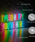 Slay All Day Pink Neon Sign For Wall Decor Dimmable USB Powered LED Light Neon Art On Clear Acrylic With Flexible Silicon Strips 17x13 Inches Perfect For Pub Store Man Cave Party Vibe in multicolor display reading 'I'm So Happy You're Here'