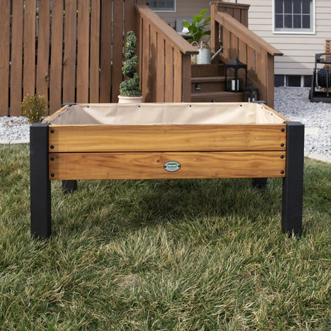 Front view of Teak Wood Raised Garden Bed Planter Box With Galvanized Steel Legs And Mesh Liner for outdoor use on patio.