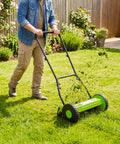Push Reel Lawn Mower 16 Inch With 5 Blade Reel For Clean Scissor Like Cuts No Fuss Adjustable Cutting Height Walk Behind Mower For Small Yards Compact Manual Grass Cutter Green Finish For Eco Friendly Yard Care. Man mowing grass in backyard