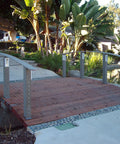 Bridge with wood deck and metal posts using Swageless Quick Connector For Cable Railings One Eighth Inch Cable Self Locking Easy Install No Caps Do It Yourself Friendly Fits Wood Metal Or Composite Posts Ten Pack.