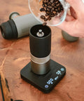 Exagram Pro Coffee Scale With Timer And Carrying Box displaying espresso grind weight on wooden table