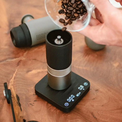 Exagram Pro Coffee Scale With Timer And Carrying Box displaying espresso grind weight on wooden table