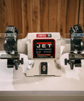 Grit And Grind Eight Inch Bench Grinder With Beefy Half Hp Motor Runs Steady At 1725 Rpm features adjustable tool rests and metal grinding capability.