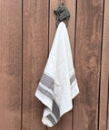 Handcrafted Cast Iron Horsehead Wall Hook With A Knockout Rustic Coffee Bean Brown Finish built like a tank holding a towel.