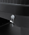 Close-up of the drainage spout on the black 120-Qt Rolling Ice Chest Cooler Cart With Wheels And Drink Dividers.