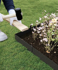 Weathering Steel Landscape Edging Kit Cor Ten 40 Inch By 8 Inch 6 Pack With Paint Finish Hammer In Strips Includes 8 Clips And Gloves Edge For Lawn And Garden Durable Rust Resistant Border 20 Ft Total being installed in garden