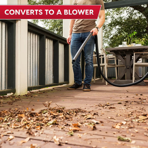 Man using the Compact 3.2 Gallon Wet Dry Shop Vacuum With 2.5 Peak HP Wall Mounted Design includes blower function on patio.