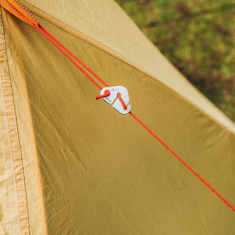 Paracord 175 Lightweight Visible Guyline For Tents And Tarps Reflective Orange 100 Ft Camping Cord installed with tent