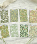 Pocket-Sized Floral Notebooks Set, 24 Mini Spiral Journals 2.36 x 3.94 Inches, 8 Vintage Botanical Designs on a white background