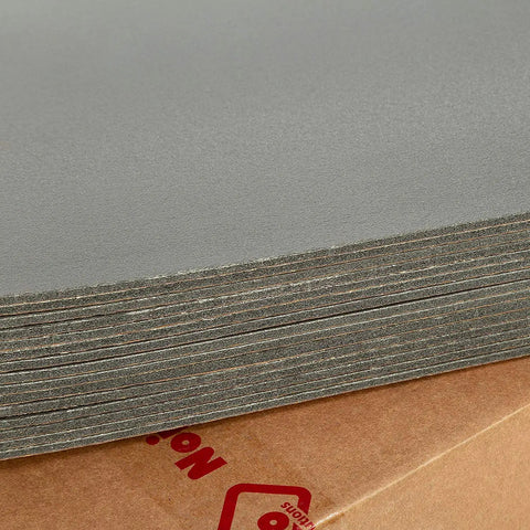 Top Shelf Car Sound Deadener 150 Mil Thick Self Adhesive Closed Cell PE Foam stacked on a cardboard base.