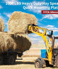 Tractor using 49 Inch Hay Bale Spear Attachment With Beefy 2000 Lb Capacity Quick Attach lifting hay bale in field.