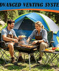 Couple cooking in front of all in one family camping tent with rain fly waterproof and windproof dome design quick setup in minutes