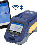 Badass Rugged Industrial Mobile Label Printer With Slick Bluetooth Setup For Grab And Go Wire Cable Tagging Or Heavy Duty Shop Work That Runs Flawless Every Single Time next to smartphone.