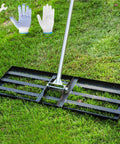 Extra Wide Lawn Leveling Rake 36 By 10 Inch With Adjustable Steel Handle on grass; includes gloves and wrench