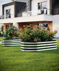 Raised Garden Bed 4x2x1 Foot For Outdoor Gardening Built To Last Designed For Vegetables And Flowers Galvanized Ground Planter Box Easy Assembly Corrosion Resistant Heavy Duty Metal Bed in a modern garden setting.