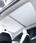Fully Retractable Aluminum Sunroof Sunshade For Tesla Model Y Heavy Duty Heat Blocker with smooth sliding panels in white interior.