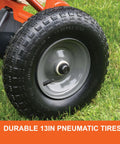 Close-up of 13-inch pneumatic tire on Big Yard Workhorse 130 Lb Walk Behind Lawn And Garden Broadcast Spreader For Seed Fertilizer Salt Ice Melt