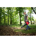 Man using Cordless Leaf Blower With Battery And Charger V20 For Quick Yard Cleanup Up To 110 MPH Air Speed Lightweight Handheld Electric Blower
