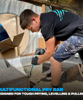 Worker using 21 Inch Flat Pry Bar With Heat Treated Forged Steel Construction And Powder Coated Finish A Long Crowbar Tool For Demolition