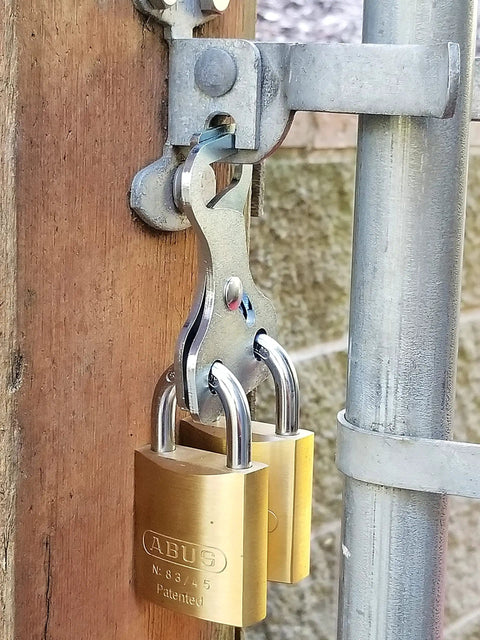 Heavy dual padlock setup on gate with 10 gauge steel locking hasp for two users, Keep Your Perimeter Locked And Loaded With This Heavy Dual Padlock Setup That Skips The Daisy Chain Drama And Gives Two Folks Smooth Shared Gate Access Daily.