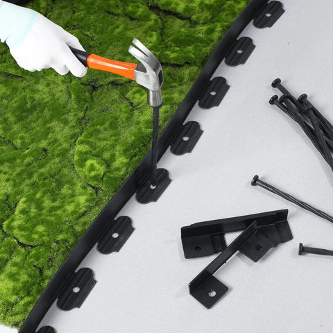 No Dig 148Ft 2 Inch Tall Landscape Edging Kit With 70 Spikes And 20 Connectors being installed on green turf