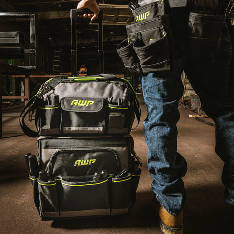 Rolling Tool Bag For Pros And Contractors Water Resistant Tough Gear Tote With Adjustable Handle in workshop setting