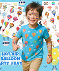 Smiling boy with hot air balloon shirt and tattoos from Hot Air Balloon Themed Temporary Tattoos Set For Kids 96 Pcs Pre Cut Stickers.