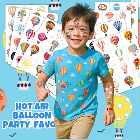Smiling boy with hot air balloon shirt and tattoos from Hot Air Balloon Themed Temporary Tattoos Set For Kids 96 Pcs Pre Cut Stickers.