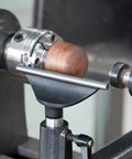 Top Shelf Heavy Duty Wood Lathe Tool Rest With Six Inch Hardened Steel Bearing Bar and Four Inch Mounting Post in use on lathe.