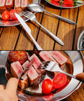 All In One 29 Piece Stainless Steel Camping Mess Kit For 4 with cutlery and plate, steak, and tomatoes on wooden table