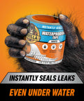 Waterproof Patch And Seal Tape White 4 Inch By 10 Foot Pack Of 1 being held by hairy hand, label showing heavy duty seal for leaks