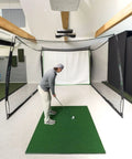 Golfer using Indoor Golf Practice Net With 10x8 Ft Hitting Net And Impact Screen, Knotless Design, indoors setup
