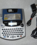 PTouch 2300 Labeling System No Fuss Stand Alone Label Maker With PC Compatibility and cords, shown from top view.