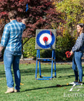 People playing with Eight Foam And Plastic Axes Axe Throwing Game Set With Heavy Duty Steel Frame Over Five Feet Tall Folds Flat