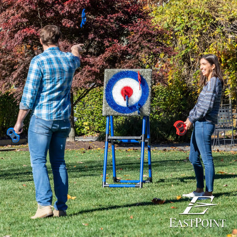 People playing with Eight Foam And Plastic Axes Axe Throwing Game Set With Heavy Duty Steel Frame Over Five Feet Tall Folds Flat