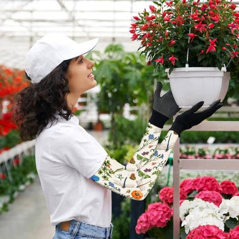 Woman gardening with Dragonfly Floral Gardening Sleeves With Sun Protection For Women And Men, Cooling Arm Covers 19 Inch.