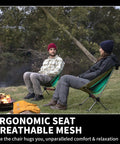 Two people sitting in Ultralight Camping Chair For Backpacking With Anti Sink Feet near a campfire, showcasing ergonomic seat.