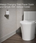 K-73148-TT Composed Vertical Toilet Tissue Holder In Titanium Finish on bathroom wall next to modern toilet